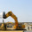 Yellow bulldozer machines digging and moving earth at construction site